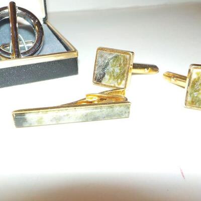 2 sets of men's tie clips and cuff links.