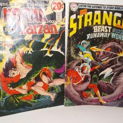 2 Tarzan and Strange Magazines".