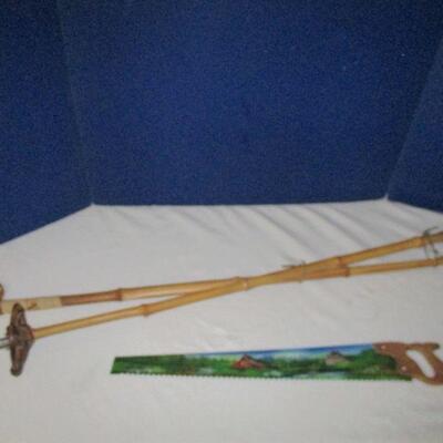 VINTAGE SNOW POLES & HAND PAINTED SAW