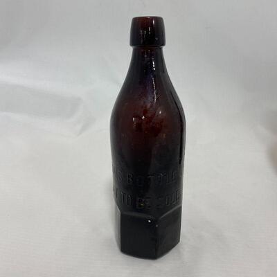 .145. Three Wisconsin Brewery Bottles