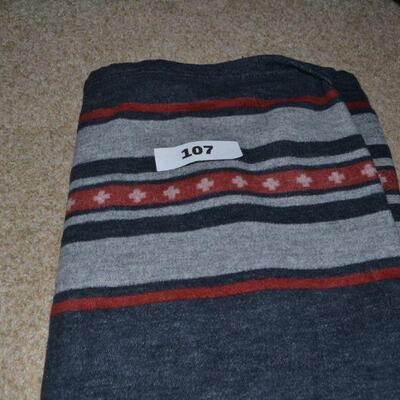 LOT 107. TWO PENDLETON THROW BLANKETS AND ONE PORTUGAL MADE BLANKET