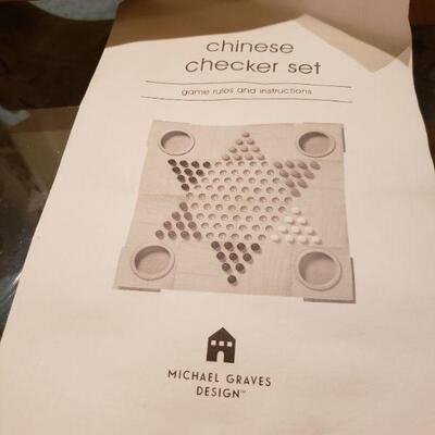 Lot 49: Michael Graves Chinese Checkers Board with Instructions 