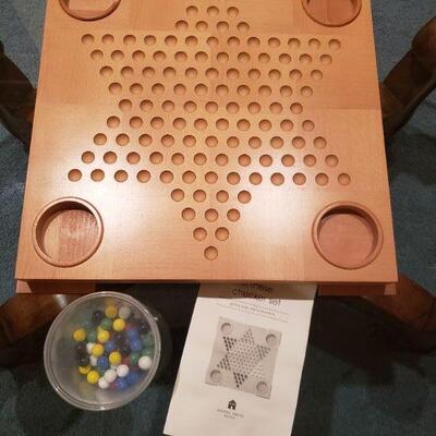 Lot 49: Michael Graves Chinese Checkers Board with Instructions 