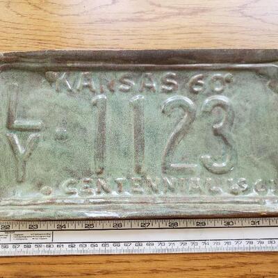 Lot 84: Ceramic Kansas License Plate Art- Signed