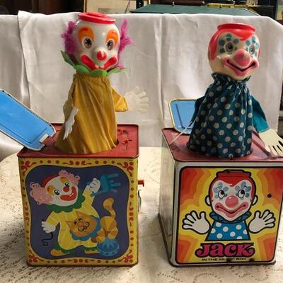 Lot 149 & 152: Jack In the Music Box: Yellow Lid, Cat, Dog, Tightrope & Jack In The Music Box: Red Top, Clown Faces on All Sides