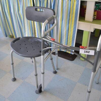 LOT 152. SHOWER CHAIR AND WALKER