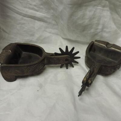 TWO METAL COWBOY SPUR ASHTRAYS