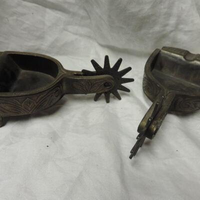 TWO METAL COWBOY SPUR ASHTRAYS