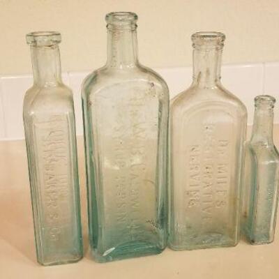 Lot #126: Assortment of (4) Antique Glass Bottles 