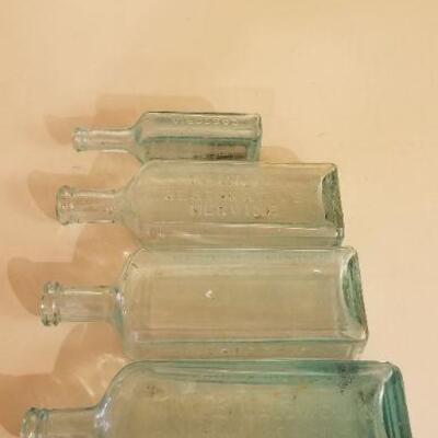 Lot #126: Assortment of (4) Antique Glass Bottles 