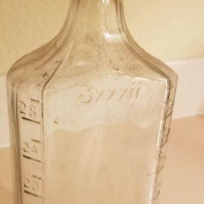 Lot #128: (3) Vintage Large Measuring Impression Glass Bottles