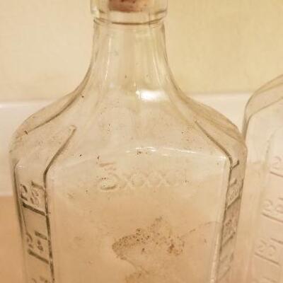 Lot #128: (3) Vintage Large Measuring Impression Glass Bottles