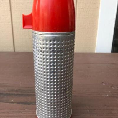 Lot 50: Aladdin Silver with Red Cup Thermos, 1950â€™s