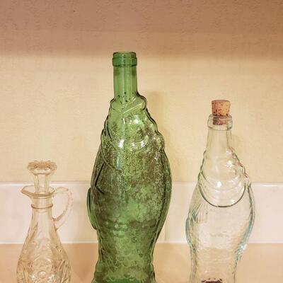 Lot 327: (2) Fish Bottles & (1) Vinegar Cruet