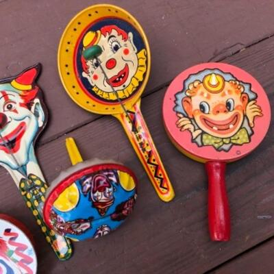 Lot 197: 7 Vintage Noise Makers: Tin, Clown Themed, 1950â€™s