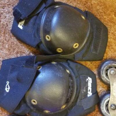 Lot #389: Vintage Pair of US Mens 8.5 Rollerblades and Assorted Knee Guard Protectors