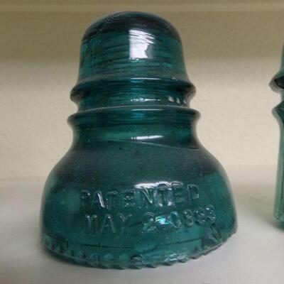 LOT 68  ANTIQUE FOUR ELECTRICAL INSULATORS & GLASS STORAGE CANISTER