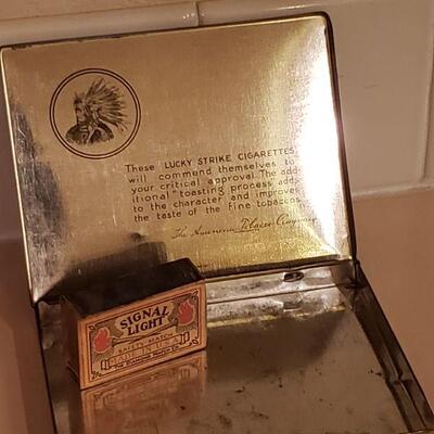 Lot 478: Vintage Lucky Strike Tin & Signal Light Matches