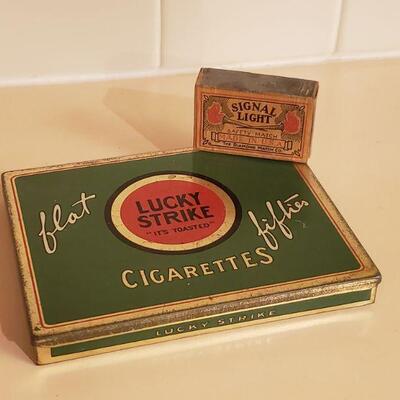 Lot 478: Vintage Lucky Strike Tin & Signal Light Matches