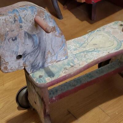 Wooden vintage rolling horse