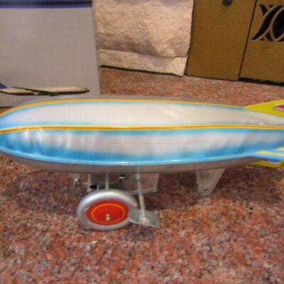 LOT  94  UNITED AIRPLANE & WIND UP BLIMP