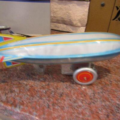 LOT  94  UNITED AIRPLANE & WIND UP BLIMP