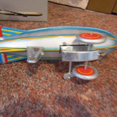 LOT  94  UNITED AIRPLANE & WIND UP BLIMP