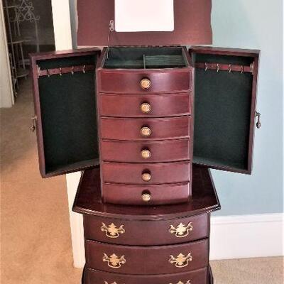 Lot #38  Queen Anne Style Jewelry Armoire with Mirror and Swing out doors