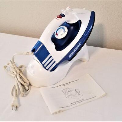 Lot #49  Oreck Cordless Steam Iron w/book
