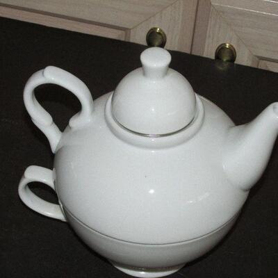 Lot 334- White World Market Teapot and Cup
