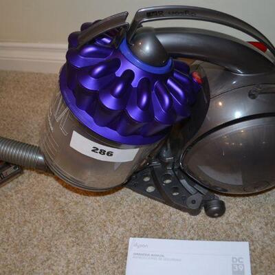 LOT 286. DYSON DC 39 CANISTER VACUUM WITH ATTACHMENTS