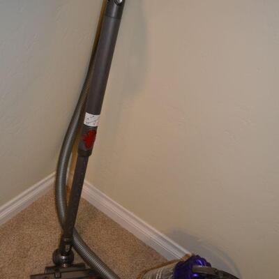 LOT 286. DYSON DC 39 CANISTER VACUUM WITH ATTACHMENTS