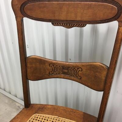 Matching Pair of Antique Oak Pressed Back Caned Seat Chairs