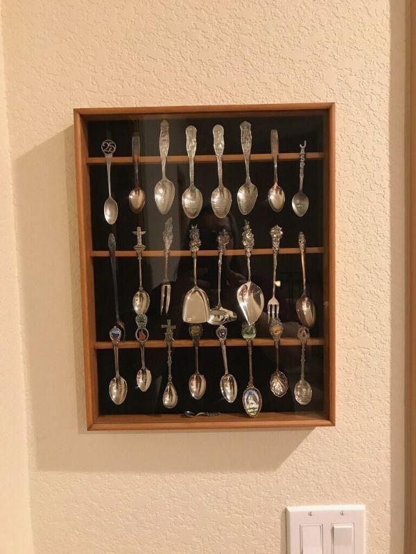 LOT 338. SOUVENIR SPOONS IN DISPLAY CASE