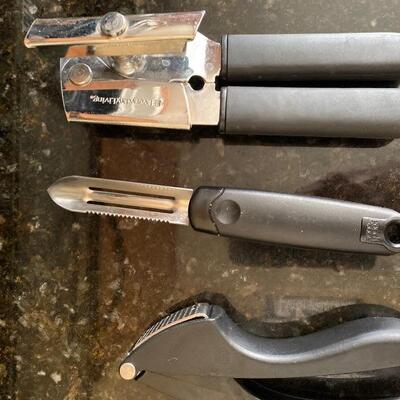 Kitchen peeler can opener garlic press 