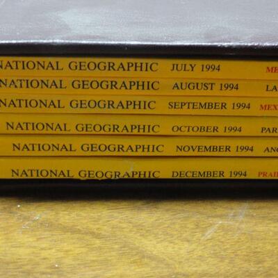 1994 National Geographic Magazine - complete set of 12 with faux leather cases Cases in great condition Books in normal good condition