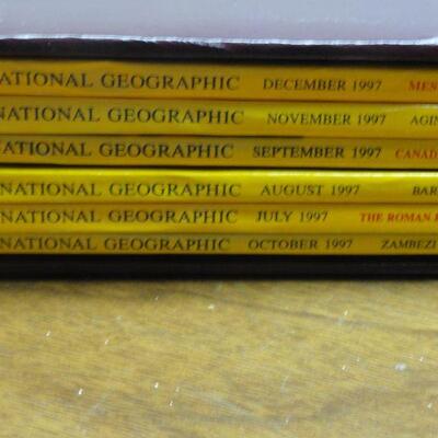 1997 National Geographic Magazine - complete set of 12 with faux leather cases Cases in great condition Books in normal good condition