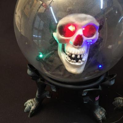 Two Spooky battery powered talking Globes with a skull and a witches head