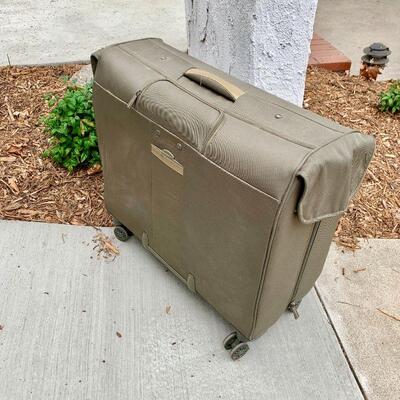 LOT 349  GARMENT BAG ON ROLLERS 