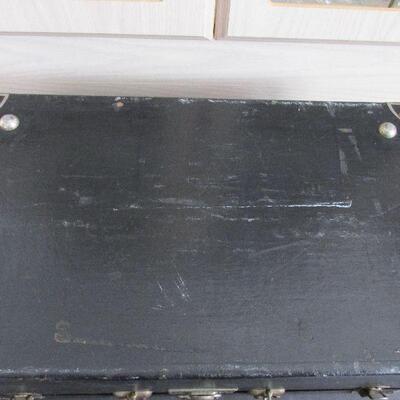 Lot 176- Vintage Black Wood Traveling Trunk