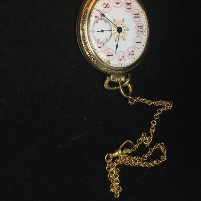 Gold Plated Pocket Watch With Red Numbers