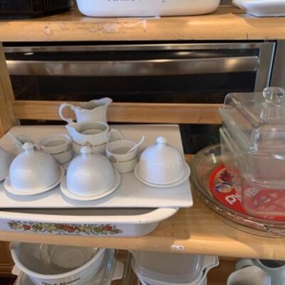Lot 7. Large assortment of Corning ware, Cuisinart food processor, kitchen utensils, white china individual butter dishes, Pyrex,...