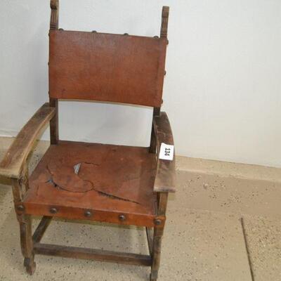 LOT 134 LEATHER AND WOOD CHAIR AS-IS