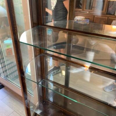 Lot 18. Antique dark oak bow front mirrored display cabinet (36Wâ€x59Hâ€x14,5â€D)--$150