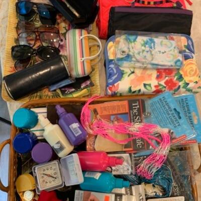 Lot 26. Designer shades and travel accessories--$25