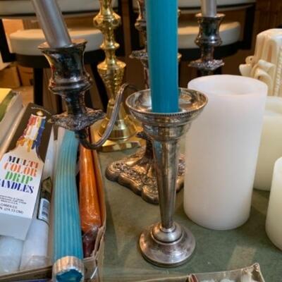 Lot 31. Assortment of wax and battery-operated candles and candlesticks--$60