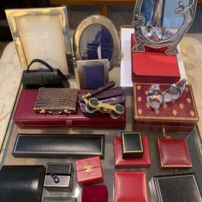 Lot 39. Assorted leather jewelry boxes, ring boxes, business card holders, antique opera glasses, frames, etc.--$75