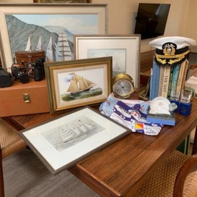 Lot 48. Assortment of nautical items- vintage bar set in leather, naval officer hat, book ends, Cunard Line accessories, etc.--$125
