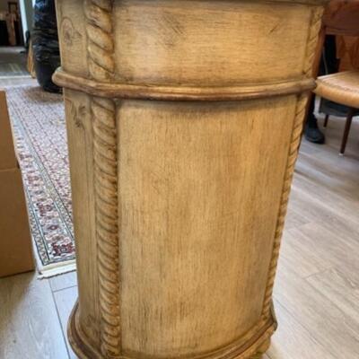 Lot 57. Oval side cabinet of distressed bleached wood--$35
