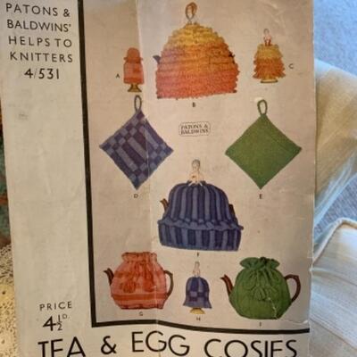 Lot 60. Collection of tea coziesâ€”2 lace, 2 knitted, and 2 of cotton and silk--$45